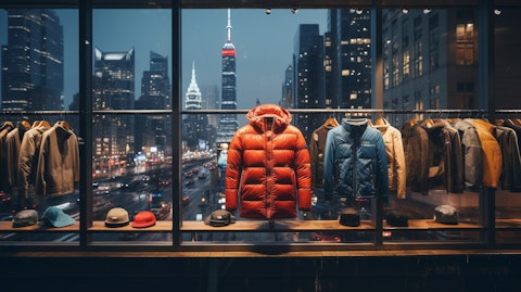 A shop window in a city skyline, showcasing the company's luxurious parkas.