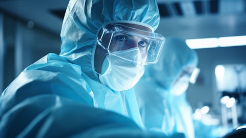 A close-up image of a lab researcher wearing safety gear, intently working on a biotechnology experiment.