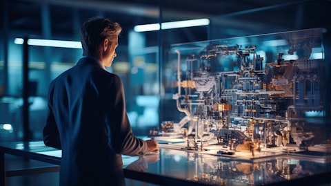 A mechanical engineer looking at a detailed industrial 3D model in a high-tech engineering facility.