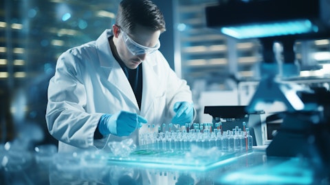 A scientist working in a modern lab, examining small-molecule and protein therapeutics.