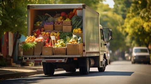 A delivery truck filled with grocery items heading to a local school.