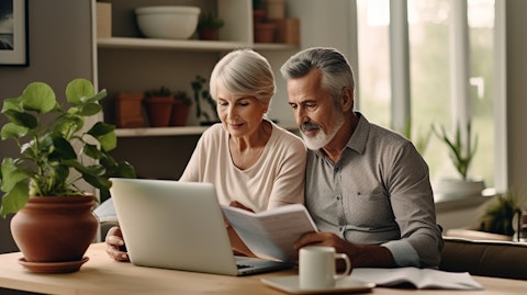 An elderly couple looking through an insurance marketplace online, symbolizing its impact for senior citizens.