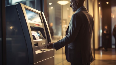 A customer using an automatic teller machine with a credit card.