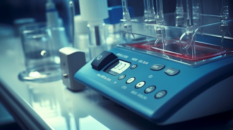 A close-up of a medical device being calibrated and tested in a clinical laboratory setting.