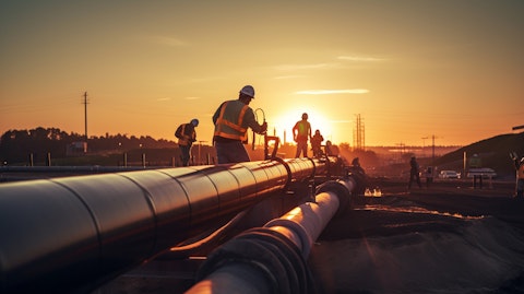 An oil and gas crew working on a midstream pipeline, illuminated against a dusk sunlit sky.