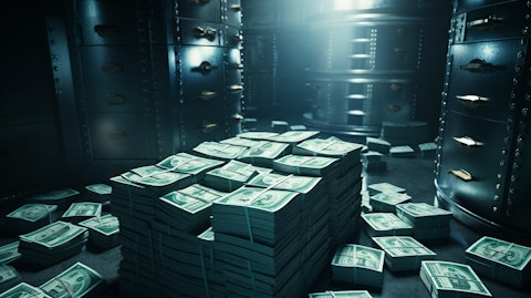 A close up of hands counting a vast stack of money in a bank vault.