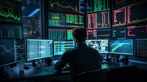 A professional trader monitoring market trends on multiple digital screens in front of them.