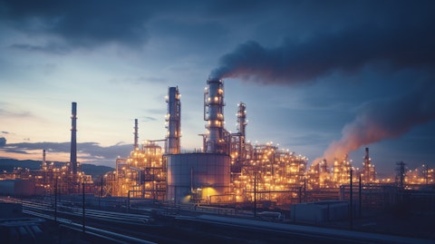 An industrial processing facility, its chimneys and machines producing specialty chemicals.