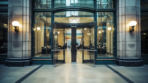 A side view of a traditional bank branch, its polished glass entrance indicating a secure and reliable banking experience.
