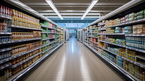 A wide aisled grocery store stocked with natural and organic groceries and dietary supplements.