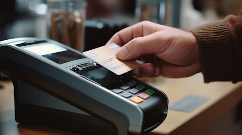 A close-up of a hand swiping a prepaid card, illustrating the secure transaction processing for cardholders.