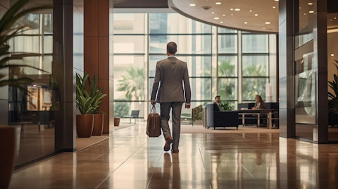 A middle-aged business executive entering the lobby of a modern regional bank.