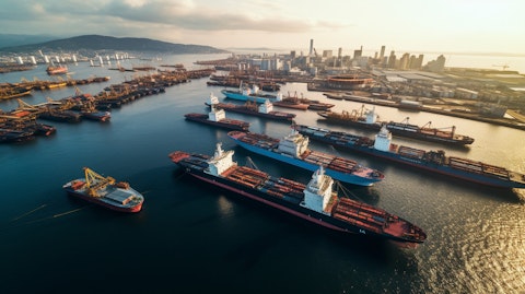 An aerial view of a bustling port, revealing a fleet of shuttle tankers transporting crude oil.