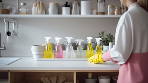 A person in a bright and spotless kitchen, showcasing the efficiency of the line of household cleaning products.