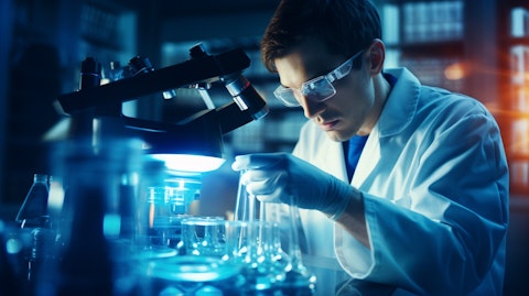 A biochemist in a laboratory performing research and development on a specialty pharmaceutical.