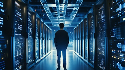 A data center operator working on a rack of servers, emphasizing the company's cloud services.