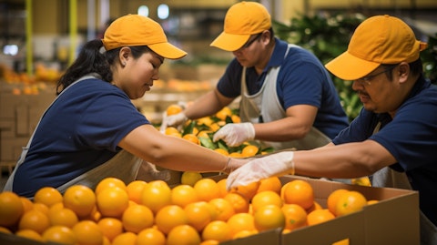 A team of packing house workers packaging specialty citrus for customer orders.