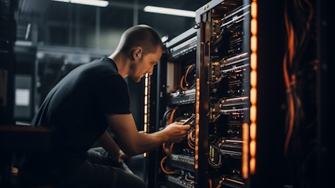 A team of technicians working on a server of bitcoin mining equipment in a data center.