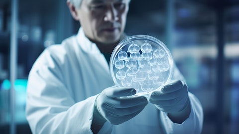 A scientist in a lab coat examining a Petri dish containing a biopharmaceutical culture.