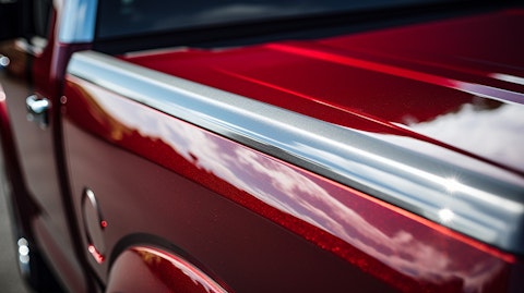 A close up of a truck with a durable, scratch-resistant, powder-coated aluminum tri-fold tonneau cover.
