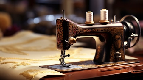 A sewing machine in use, illustrating the company's specialty retailing of fabrics.