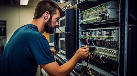A technician assembling a passive entry passive start system.