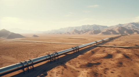 Aerial view of a pipeline transporting crude oil over a desert landscape.