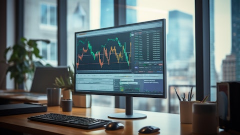 A bright lcd monitor in a modern office, showing the technology developed by the company.