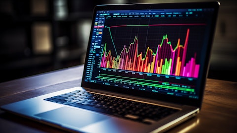A close-up of a laptop displaying a colourful graph illustrating the financial markets digital transformation.
