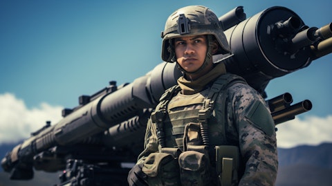 A military personnel in gear next to a shoulder-fired launcher, representing the company's less-lethal defense technology.