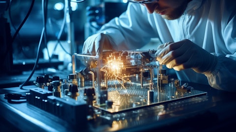 A technician soldering a cryogenic amplifier in a laboratory environment.