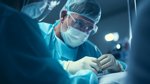A surgeon injecting a medical device into a patient in an operating theater.