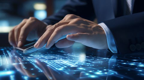 A close-up of a busy executive's hand tapping the screen of a digital device, signifying the development of a digital retail banking solution.