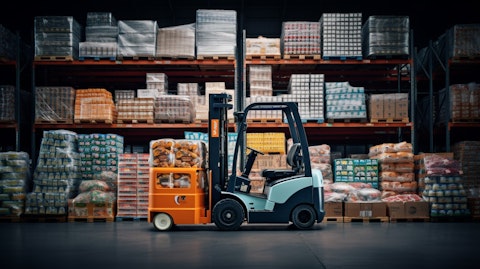 A forklift stocking shelves with newly manufactured food packaging products.