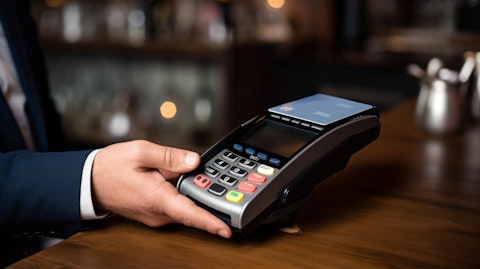 A businessman at a smart POS terminal, demonstrating contactless payment methods.