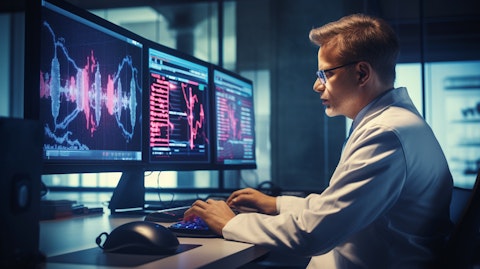 A scientist in a lab coat inspecting a flowchart on a computer monitor to diagnose and treat cardiovascular diseases.