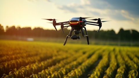 A drone hovering over a vibrant field of crops, demonstrating the company's agricultural products.
