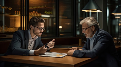 An individual investor discussing their portfolio with a wealth and asset management services client advisor.