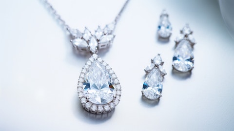A close up of a beautiful, elegant moissanite jewelry set finely crafted with a white background.