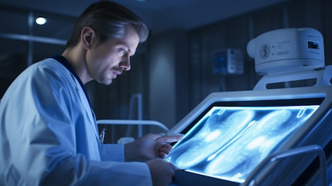 A doctor consulting with a patient in a hospital, as the doctor reviews the patient's ultrasound images.