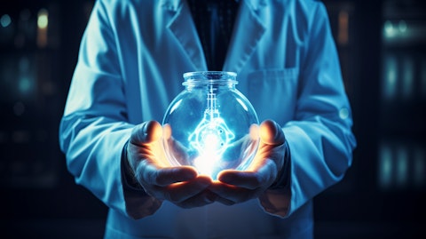 A doctor in a lab coat holding a healthcare solution in their hands.