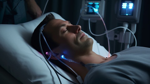 A close-up of a medical professional using a Portable Neuromodulation Stimulator (PoNS) on a patient.