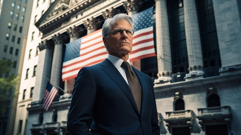 A distinguished looking executive in corporate attire standing in front of the Stock Exchange building.