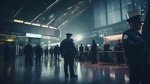 A wide shot of a public facility with security personnel monitoring the entrance.