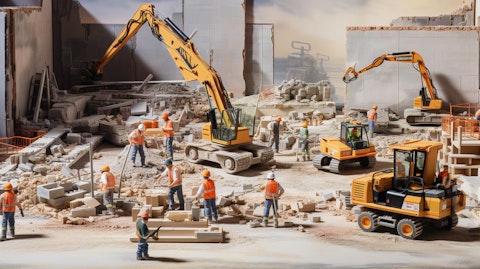 A busy construction site with workers hard at work, illustrating the industrials division.