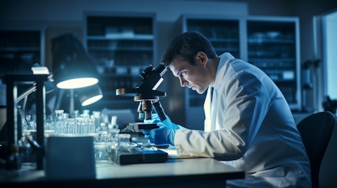 A scientist analyzing antibodies in a lab.