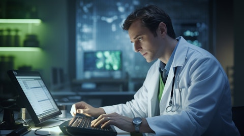 A medical professional wearing a lab coat using an advanced ECG device.
