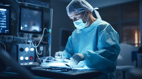 A specialist operating a modern medical device in a clinical setting.