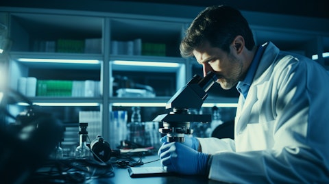 A scientist in a lab coat looking through a microscope, evaluating an advanced medical device.