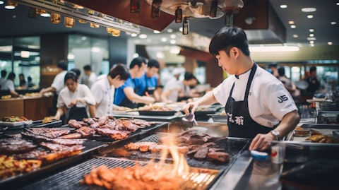 A busy Korean barbecue restaurant, full of customers experiencing the traditional flavors.